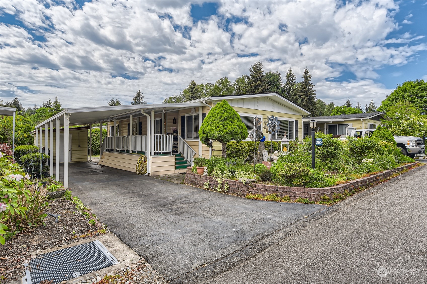1121 244th Street Southwest, Unit 50 Bothell, WA 98021 - Photo 1 of 22 front view of a house with a garden