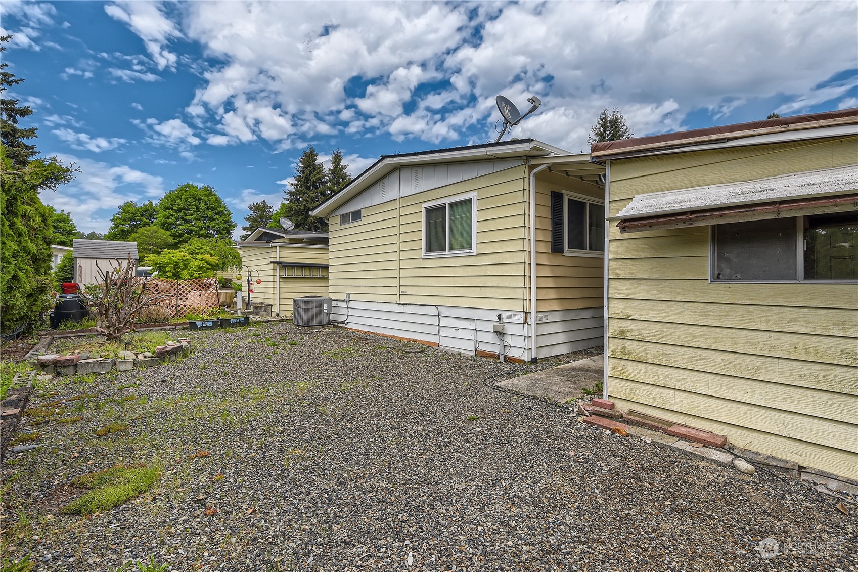 1121 244th Street Southwest, Unit 50 Bothell, WA 98021 - Photo 16 of 22 a view of a house with a backyard
