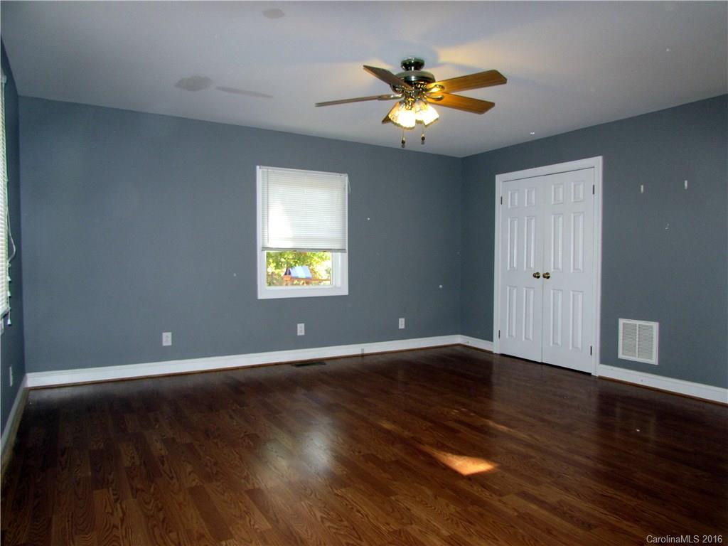4545 Musket Hill Road Sharon, SC 29742 - Photo 11 of 20 a view of an empty room with wooden floor and a window