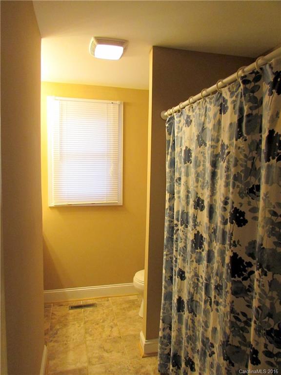 4545 Musket Hill Road Sharon, SC 29742 - Photo 12 of 20 a view of bathroom with a shower curtain and a large window