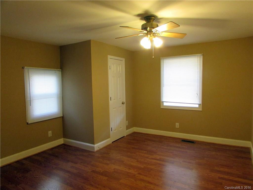 4545 Musket Hill Road Sharon, SC 29742 - Photo 13 of 20 a view of an empty room with wooden floor and a window