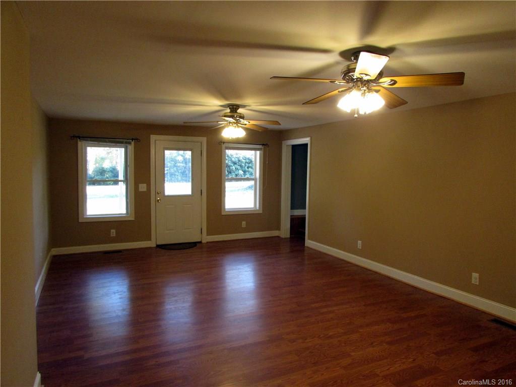 4545 Musket Hill Road Sharon, SC 29742 - Photo 15 of 20 a view of an empty room with window and wooden floor