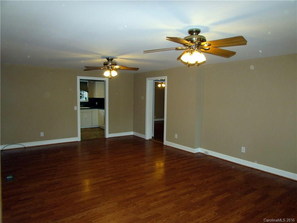 4545 Musket Hill Road Sharon, SC 29742 - Photo 3 of 20 a view of a livingroom with a chandelier fan and a kitchen