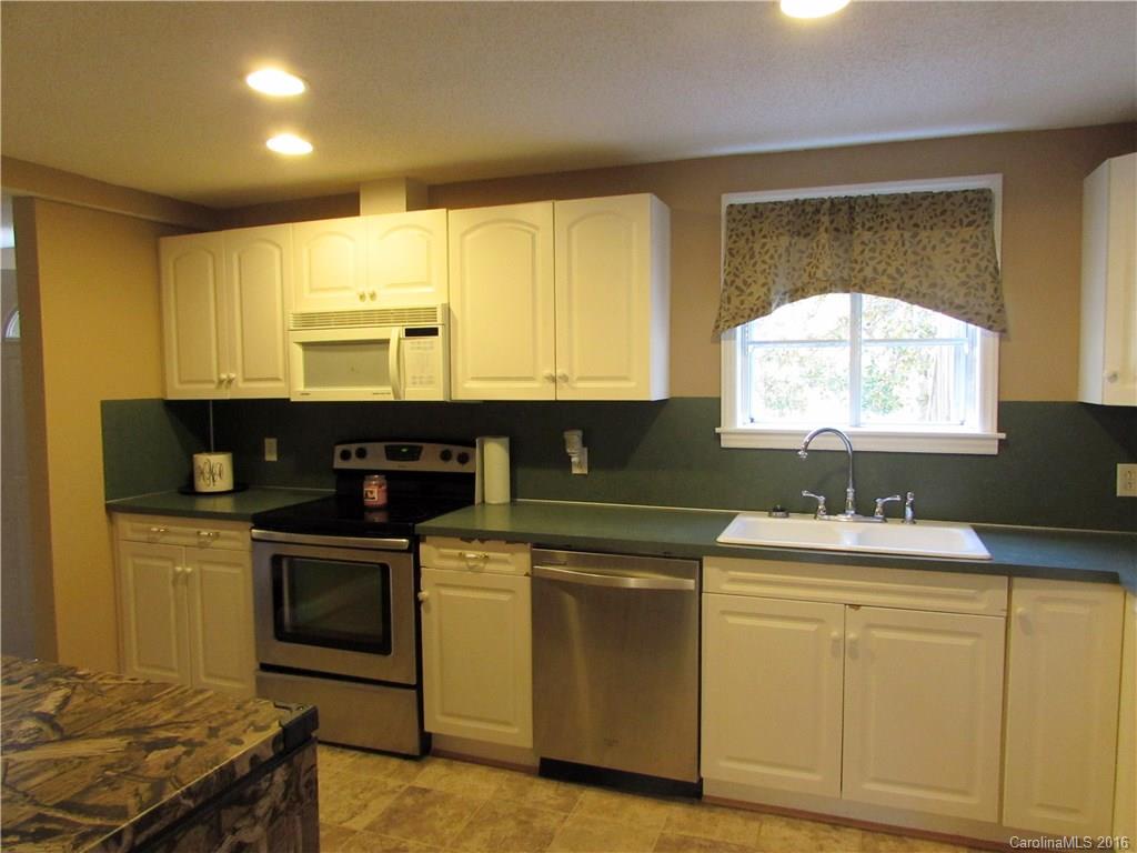 4545 Musket Hill Road Sharon, SC 29742 - Photo 10 of 20 a kitchen with a sink stove and cabinets