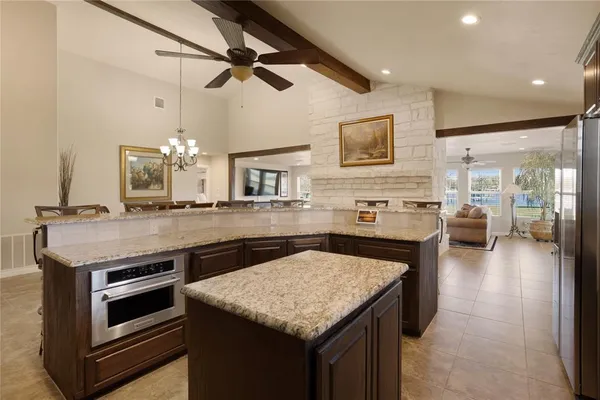 a kitchen with a stove and a microwave