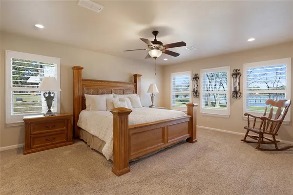 a bed room with a bed and a window