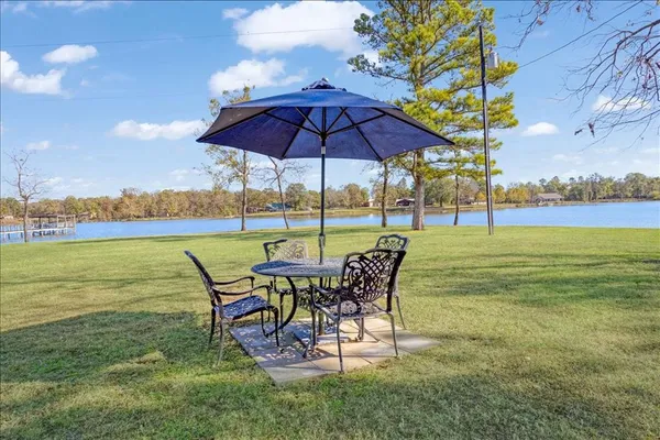 a view of a table and chairs in the garden