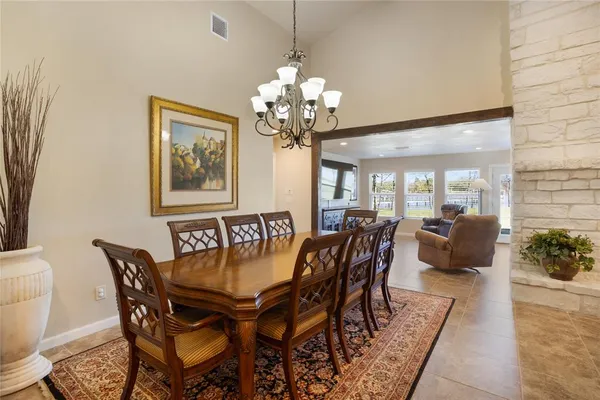 a dining room with furniture and window