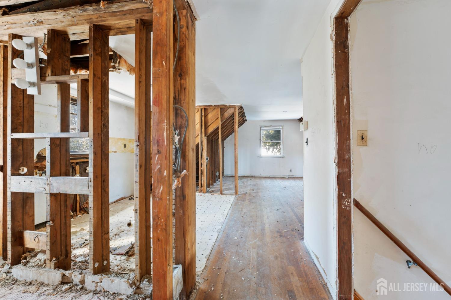 20 High Street New Providence, NJ 07974 - Photo 11 of 31 a view of a hallway with wooden floor and entryway