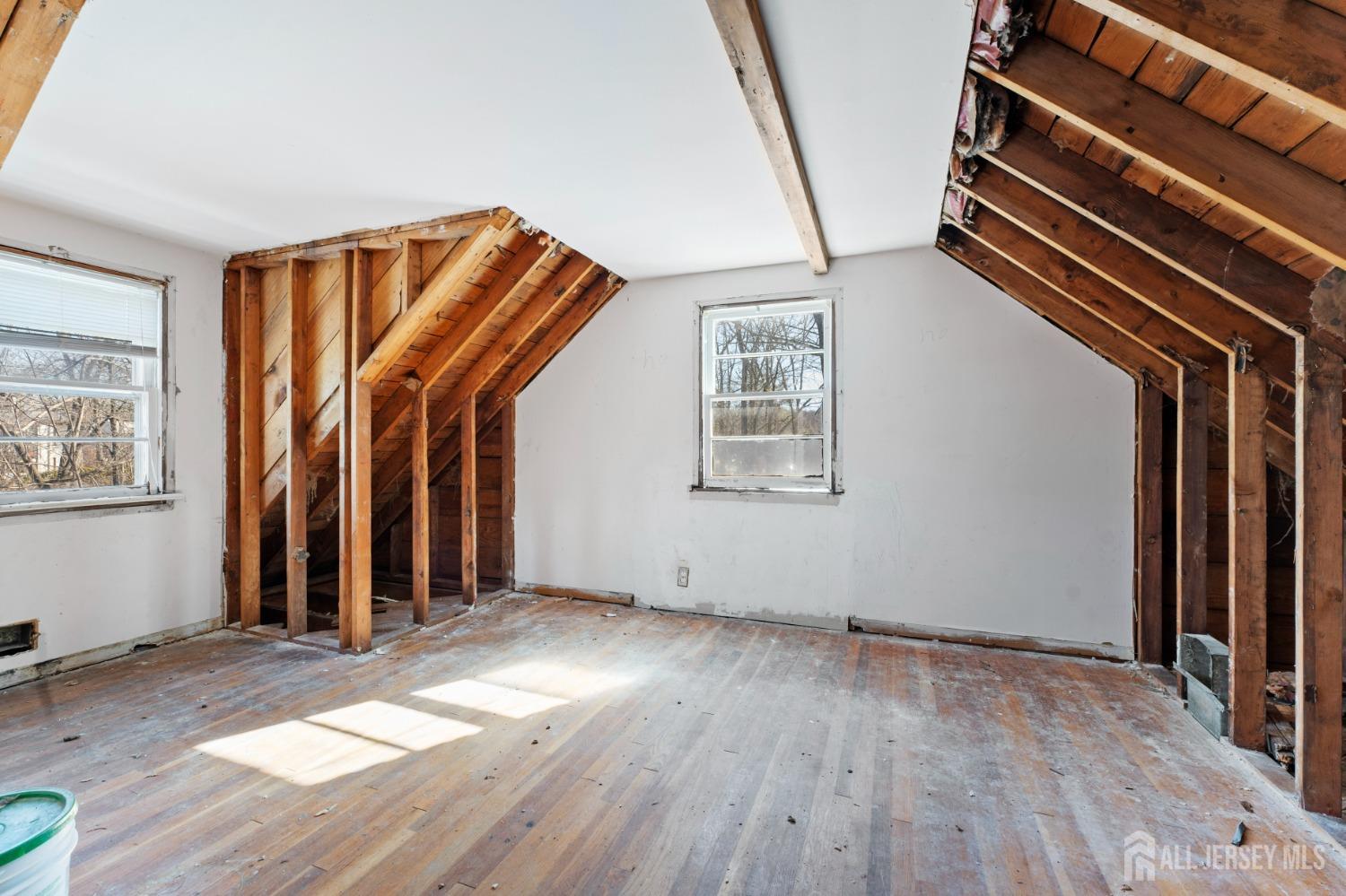 20 High Street New Providence, NJ 07974 - Photo 13 of 31 an empty room with wooden floor and windows