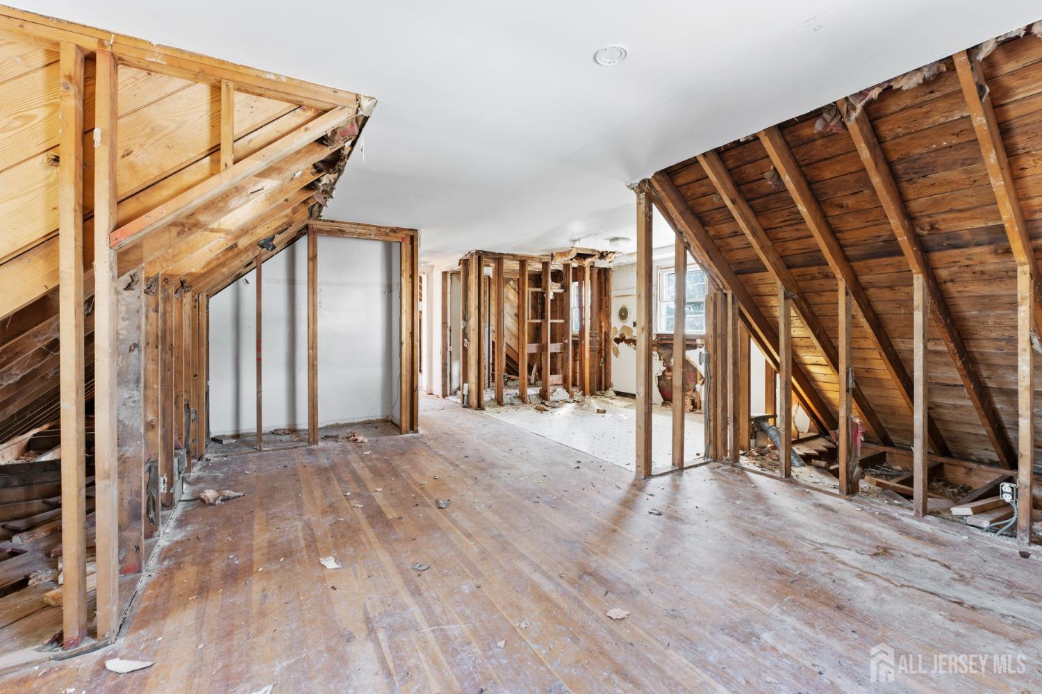 20 High Street New Providence, NJ 07974 - Photo 14 of 31 a view of empty room with wooden floor and windows