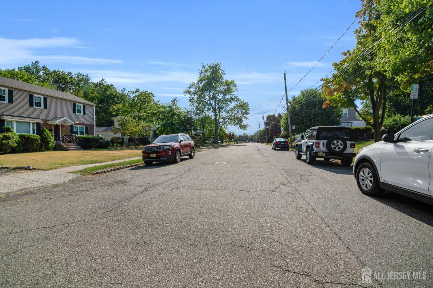 20 High Street New Providence, NJ 07974 - Photo 24 of 31 a car parked on the side of a street