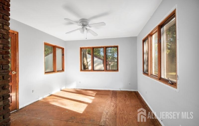 20 High Street New Providence, NJ 07974 - Photo 27 of 31 a view of an empty room with wooden floor and a window