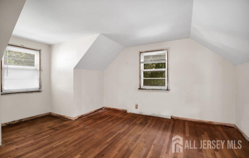20 High Street New Providence, NJ 07974 - Photo 28 of 31 an empty room with wooden floor and windows