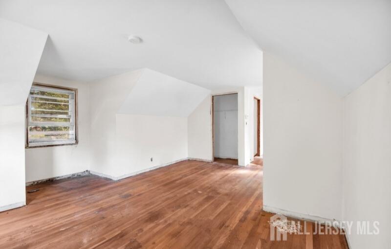 20 High Street New Providence, NJ 07974 - Photo 29 of 31 a view of an empty room with wooden floor and a window