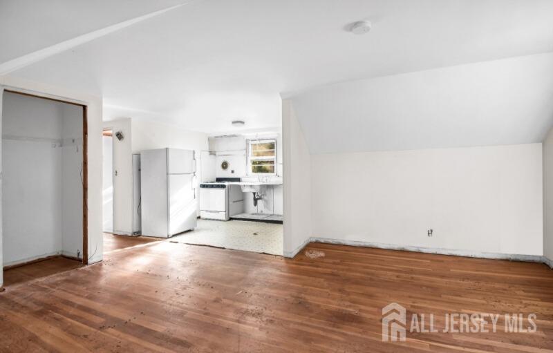 20 High Street New Providence, NJ 07974 - Photo 30 of 31 a view of kitchen with refrigerator and wooden floor