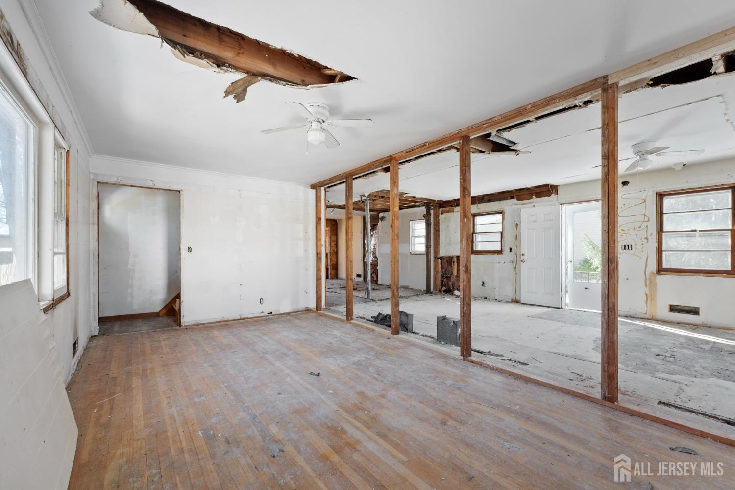 20 High Street New Providence, NJ 07974 - Photo 6 of 31 an empty room with wooden floor and windows