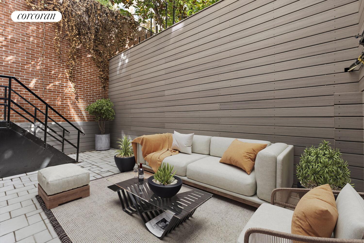 154 9th Avenue Manhattan, NY 10011 - Photo 2 of 11 a view of patio with couches and a potted plant