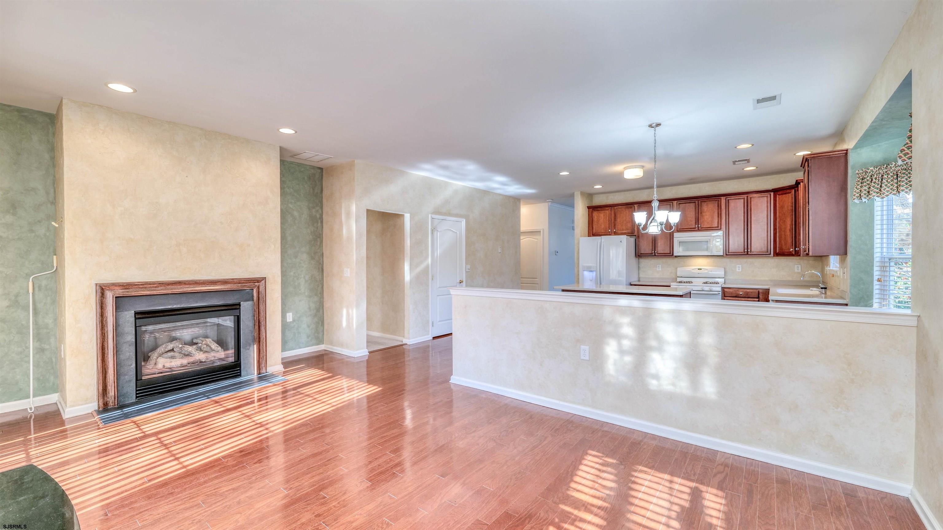 212 Lander Road Egg Harbor Township, NJ 08234 - Photo 11 of 33 a view of a kitchen with a sink and a fireplace