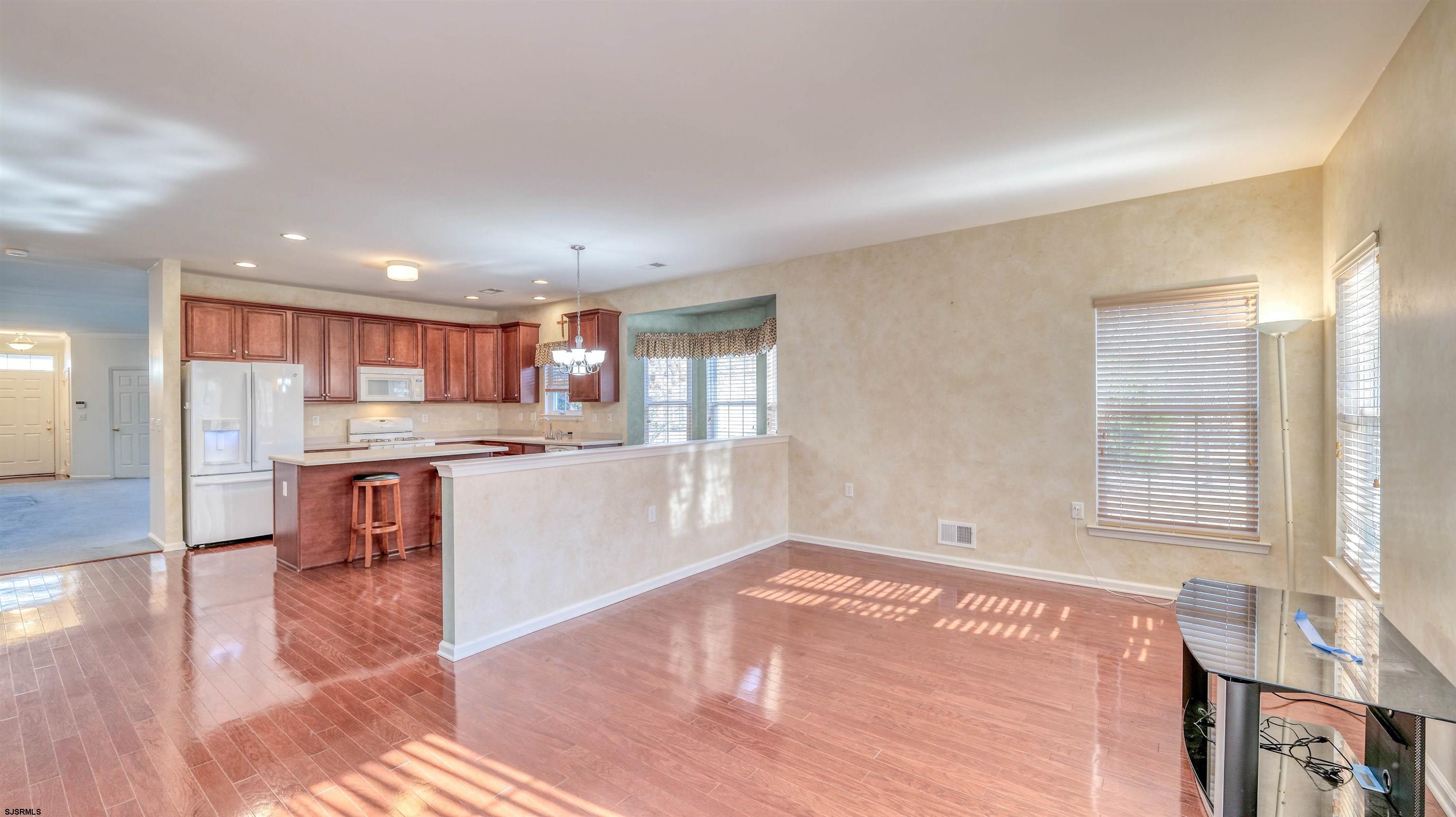 212 Lander Road Egg Harbor Township, NJ 08234 - Photo 12 of 33 a kitchen with a table and chairs in it