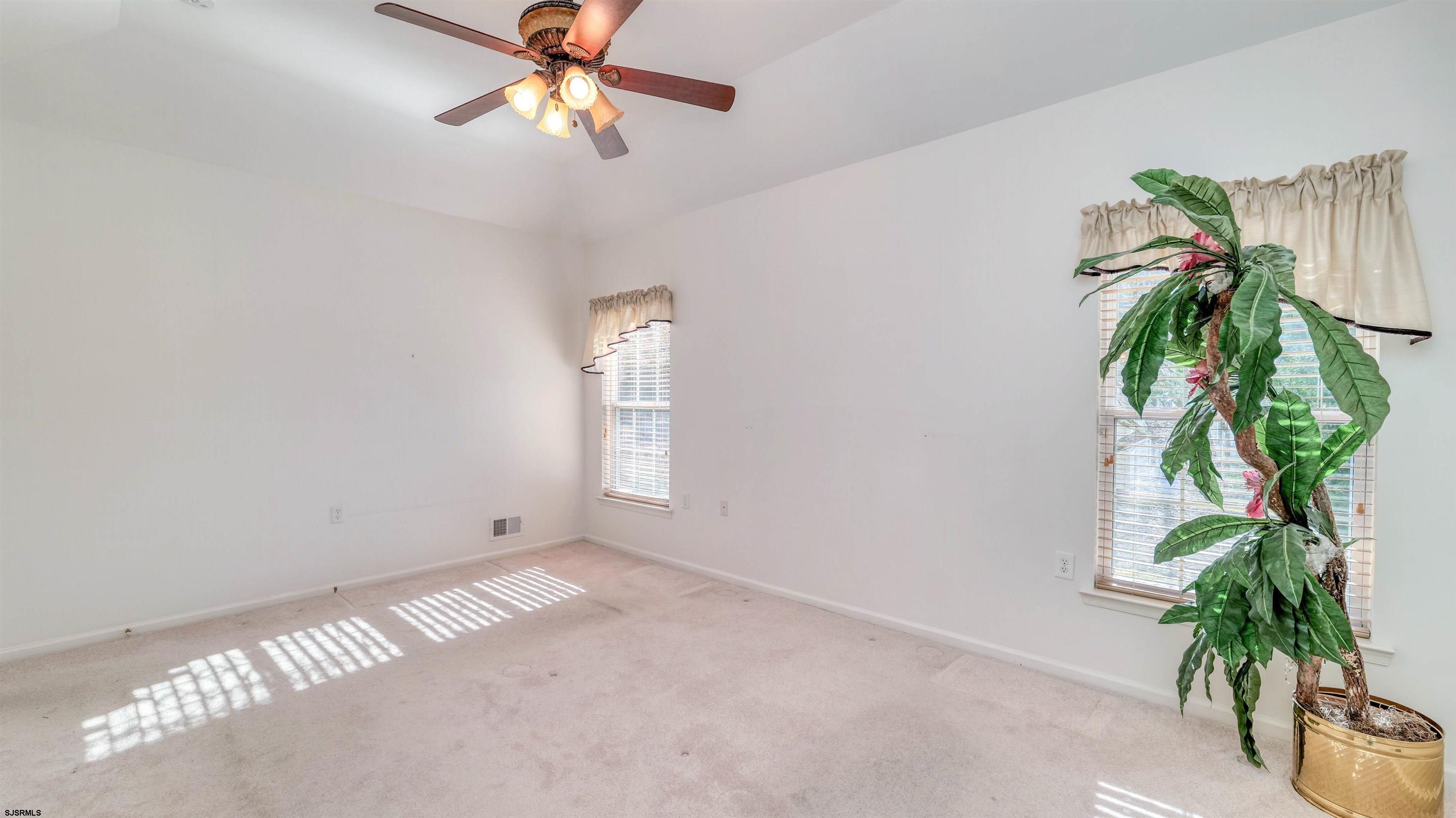 212 Lander Road Egg Harbor Township, NJ 08234 - Photo 14 of 33 a view of a room with a potted plant