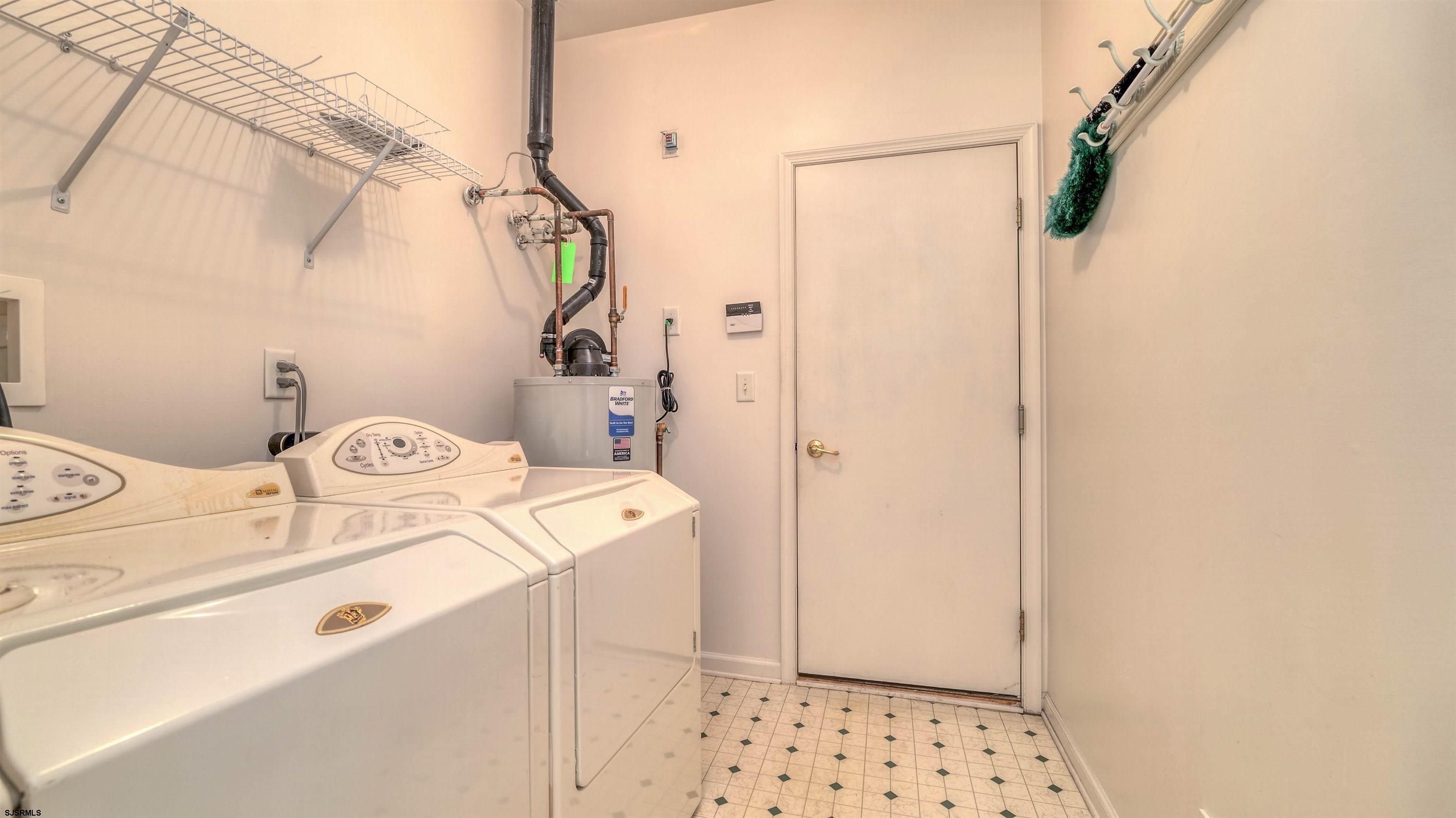 212 Lander Road Egg Harbor Township, NJ 08234 - Photo 21 of 33 a utility room with dryer and washer