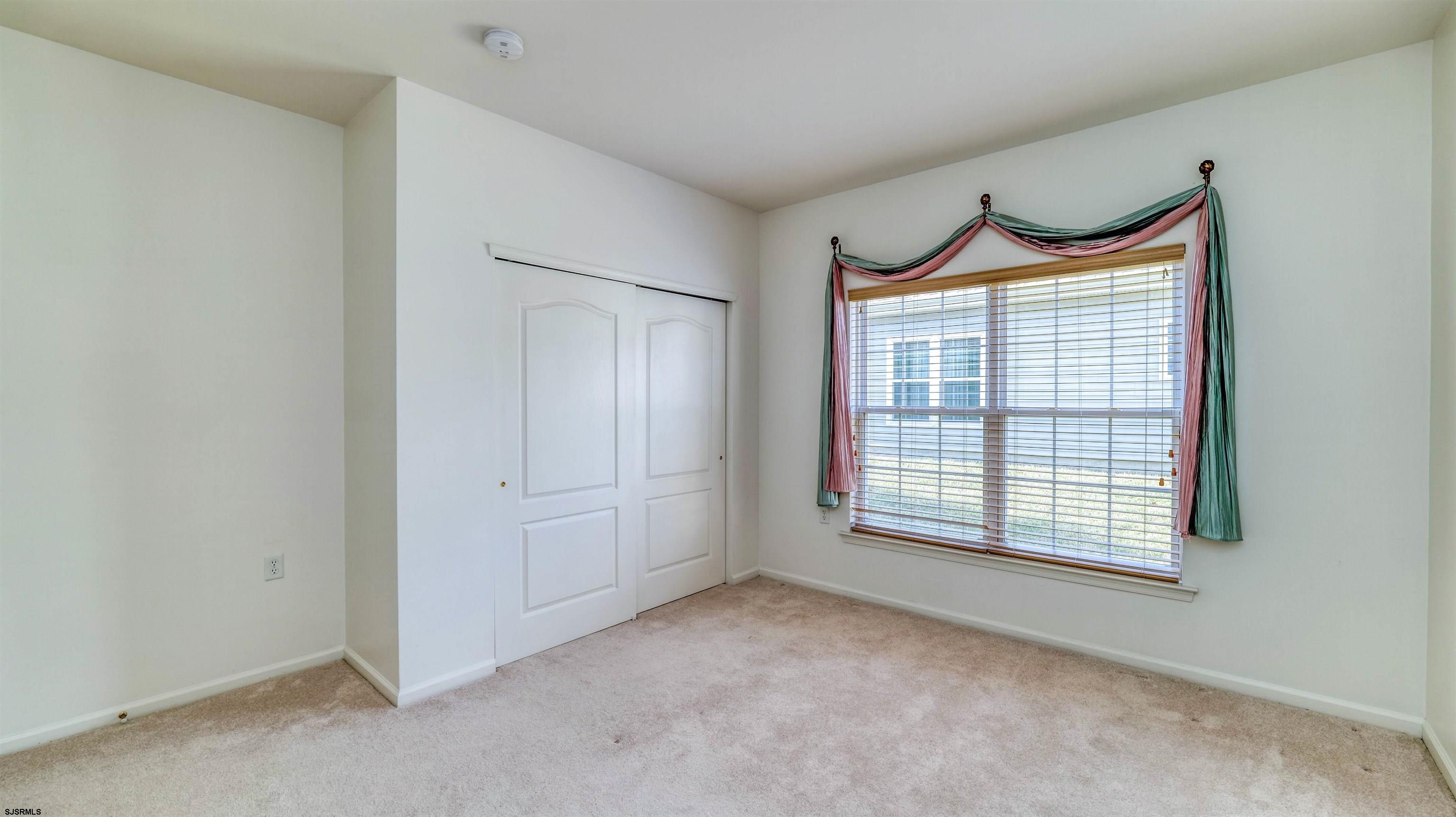 212 Lander Road Egg Harbor Township, NJ 08234 - Photo 23 of 33 a view of an empty room with a fireplace and cabinet