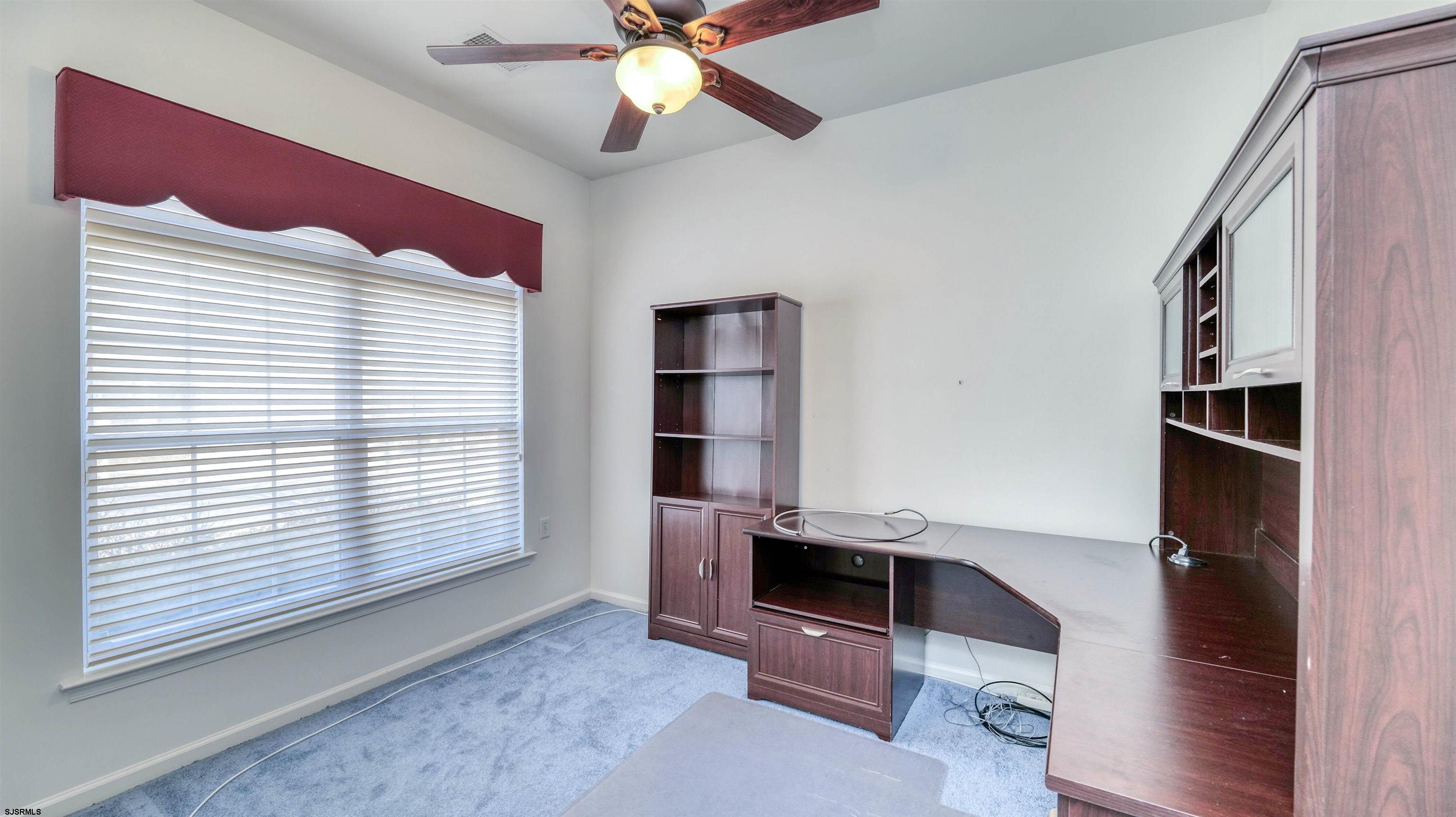 212 Lander Road Egg Harbor Township, NJ 08234 - Photo 24 of 33 a view of an empty room with a cabinet and a window