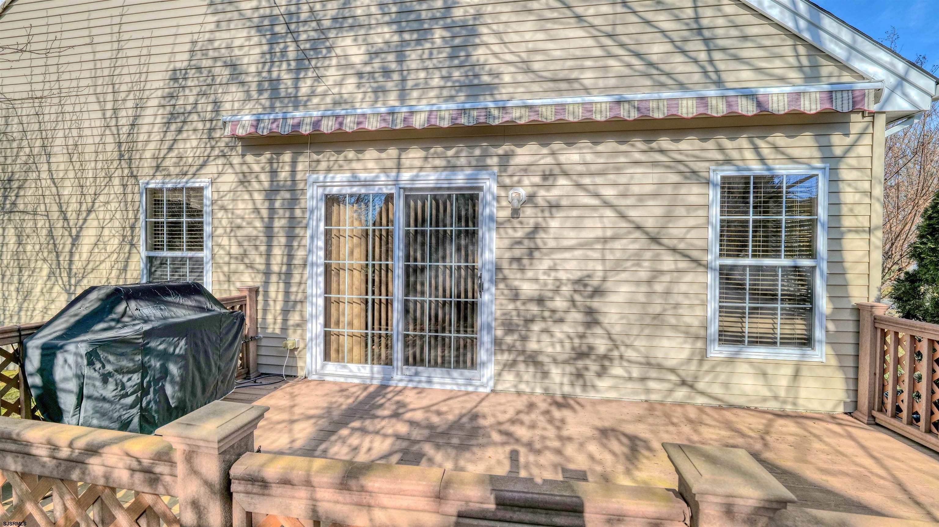 212 Lander Road Egg Harbor Township, NJ 08234 - Photo 29 of 33 a front view of a house with large windows