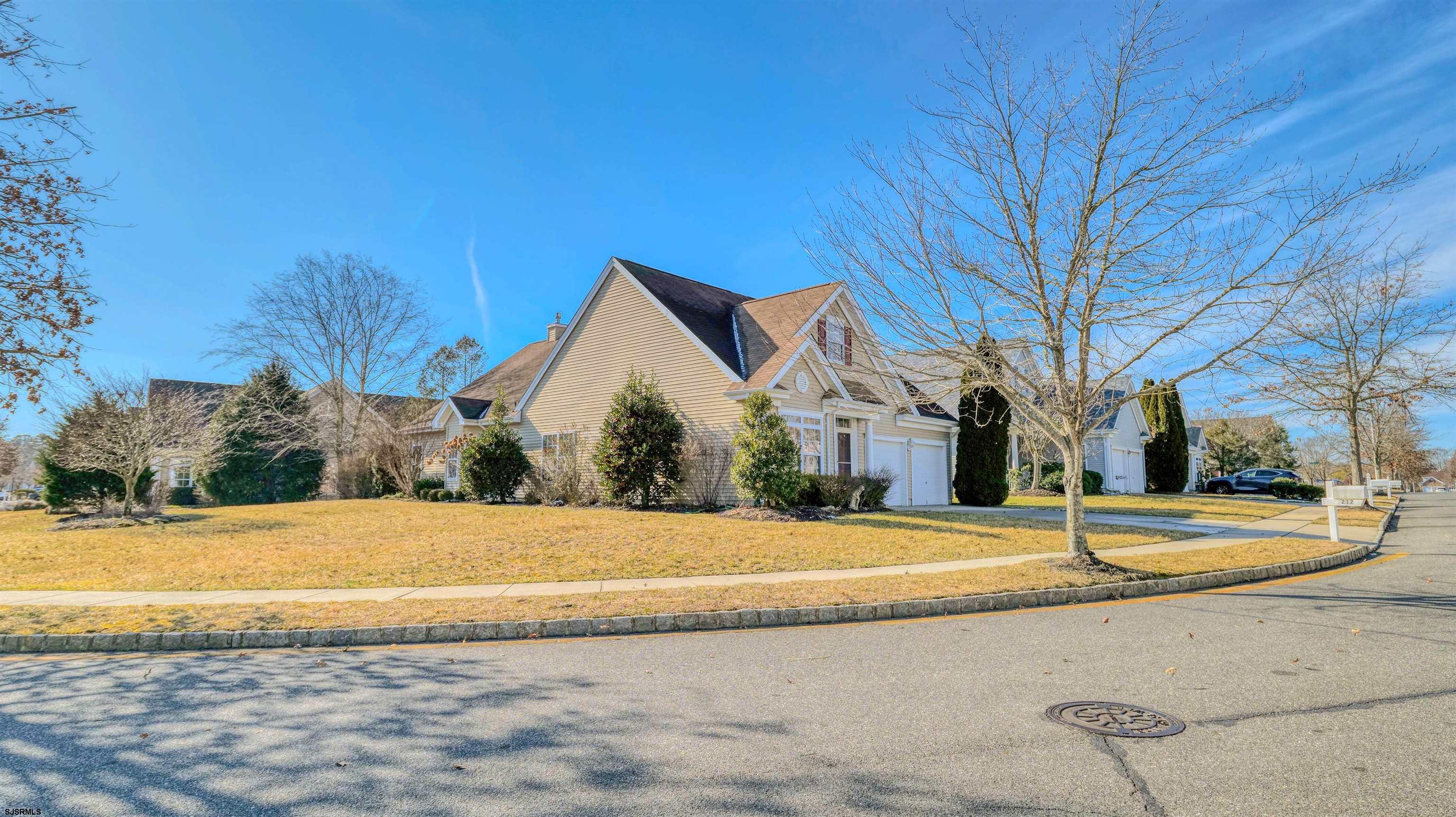 212 Lander Road Egg Harbor Township, NJ 08234 - Photo 3 of 33 a view of a house with a yard and large trees