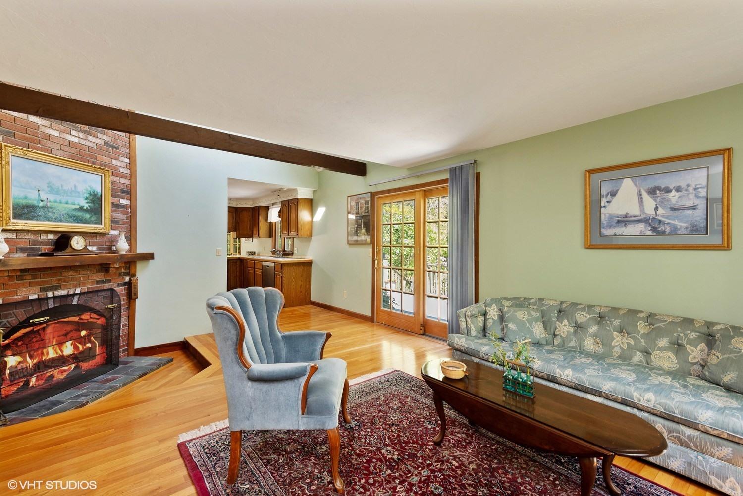 274 Elliott Road Centerville, MA 02632 - Photo 3 of 15 a living room with furniture and a fireplace