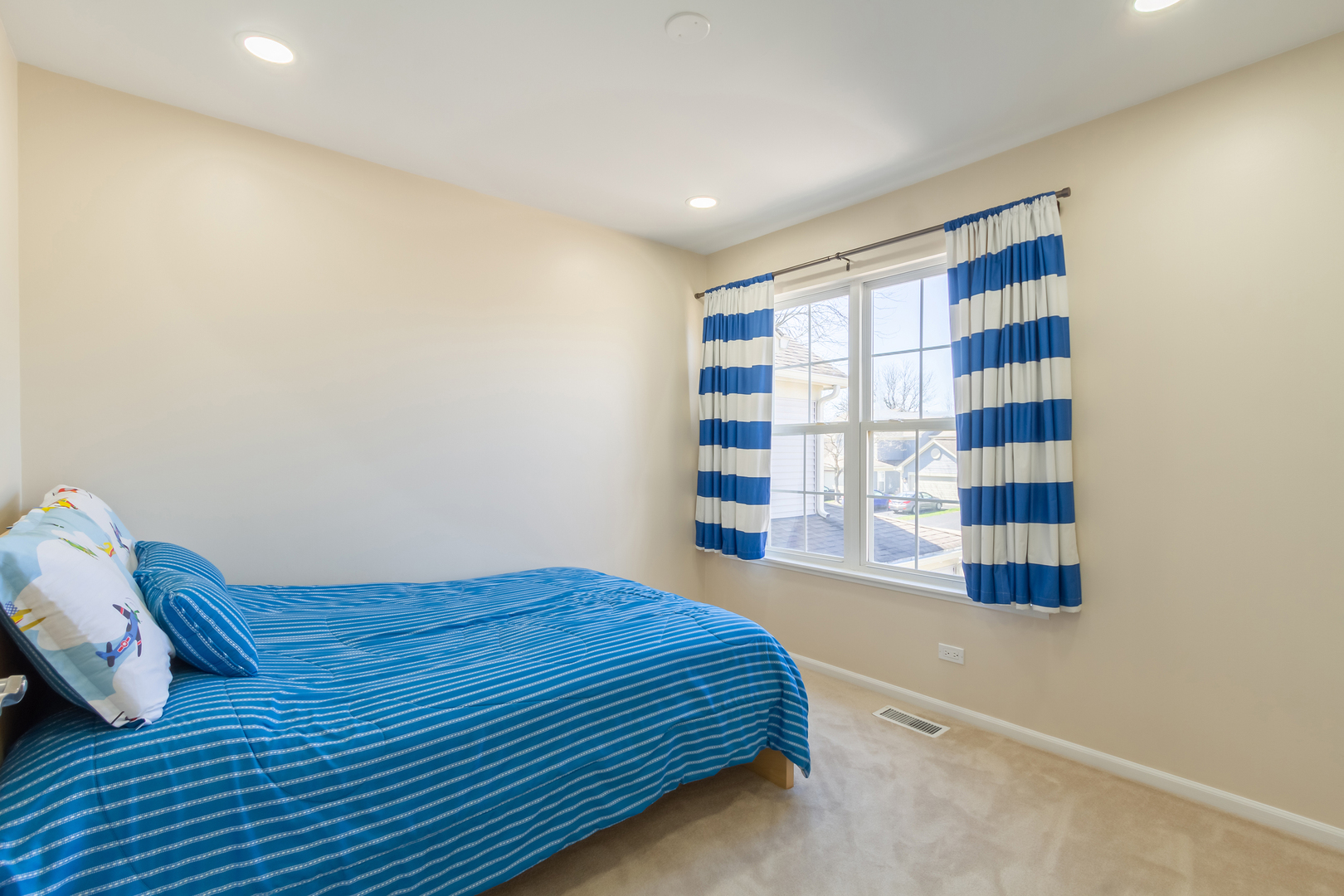 715 Bent Ridge Lane Elgin, IL 60120 - Photo 18 of 20 a bedroom with a bed and a window