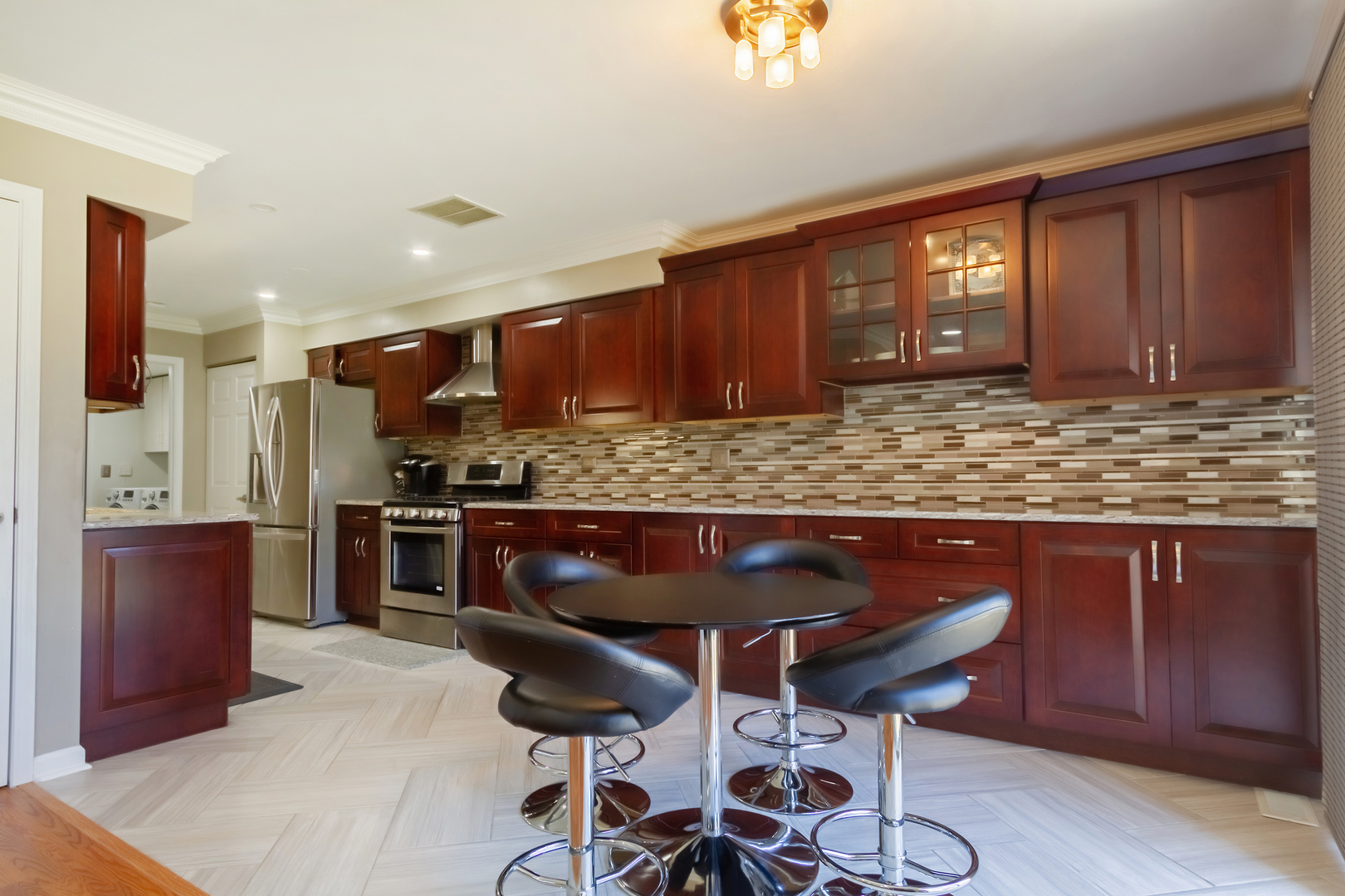 715 Bent Ridge Lane Elgin, IL 60120 - Photo 7 of 20 a kitchen with stainless steel appliances granite countertop wooden cabinets a stove top oven a sink and dishwasher