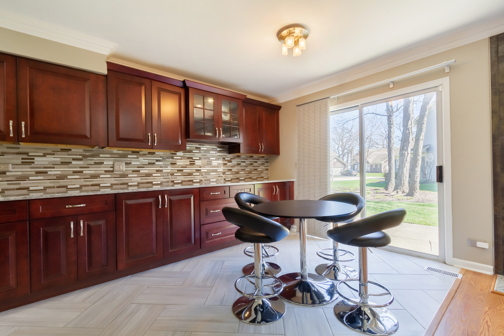 715 Bent Ridge Lane Elgin, IL 60120 - Photo 8 of 20 a kitchen with a table and chairs