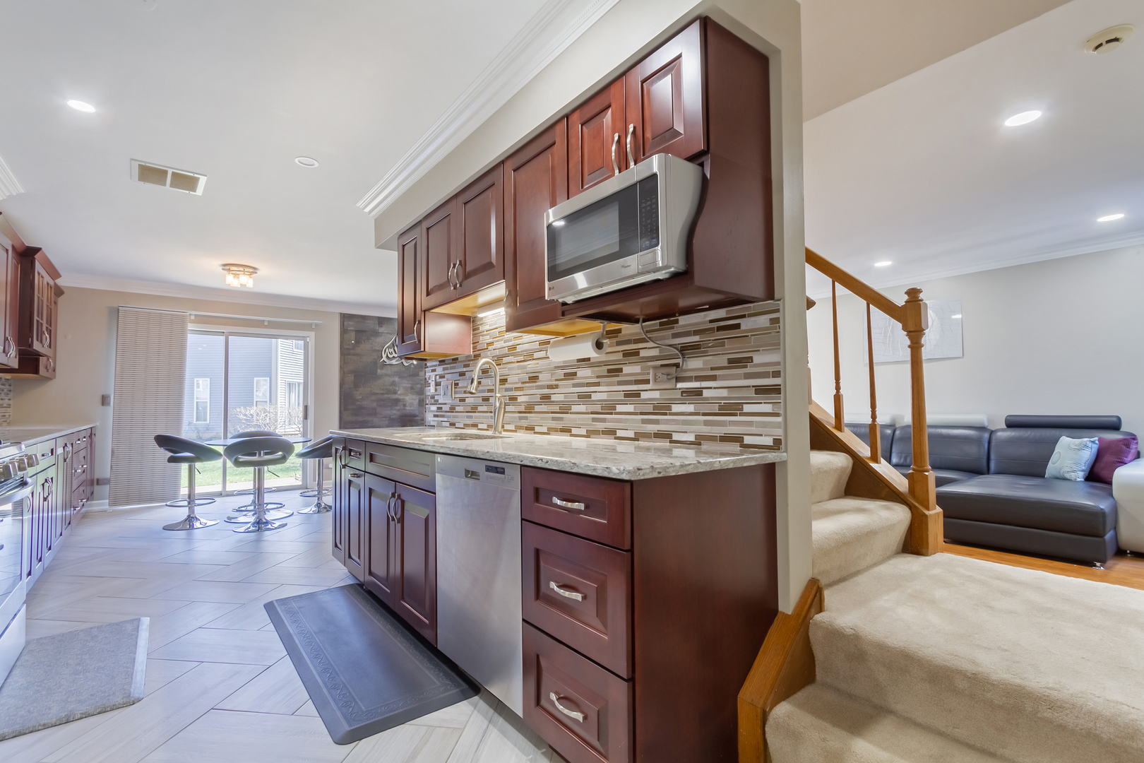 715 Bent Ridge Lane Elgin, IL 60120 - Photo 9 of 20 a kitchen with a stove a sink and a microwave