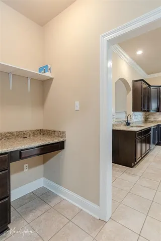 a kitchen with stainless steel appliances granite countertop a sink and a stove