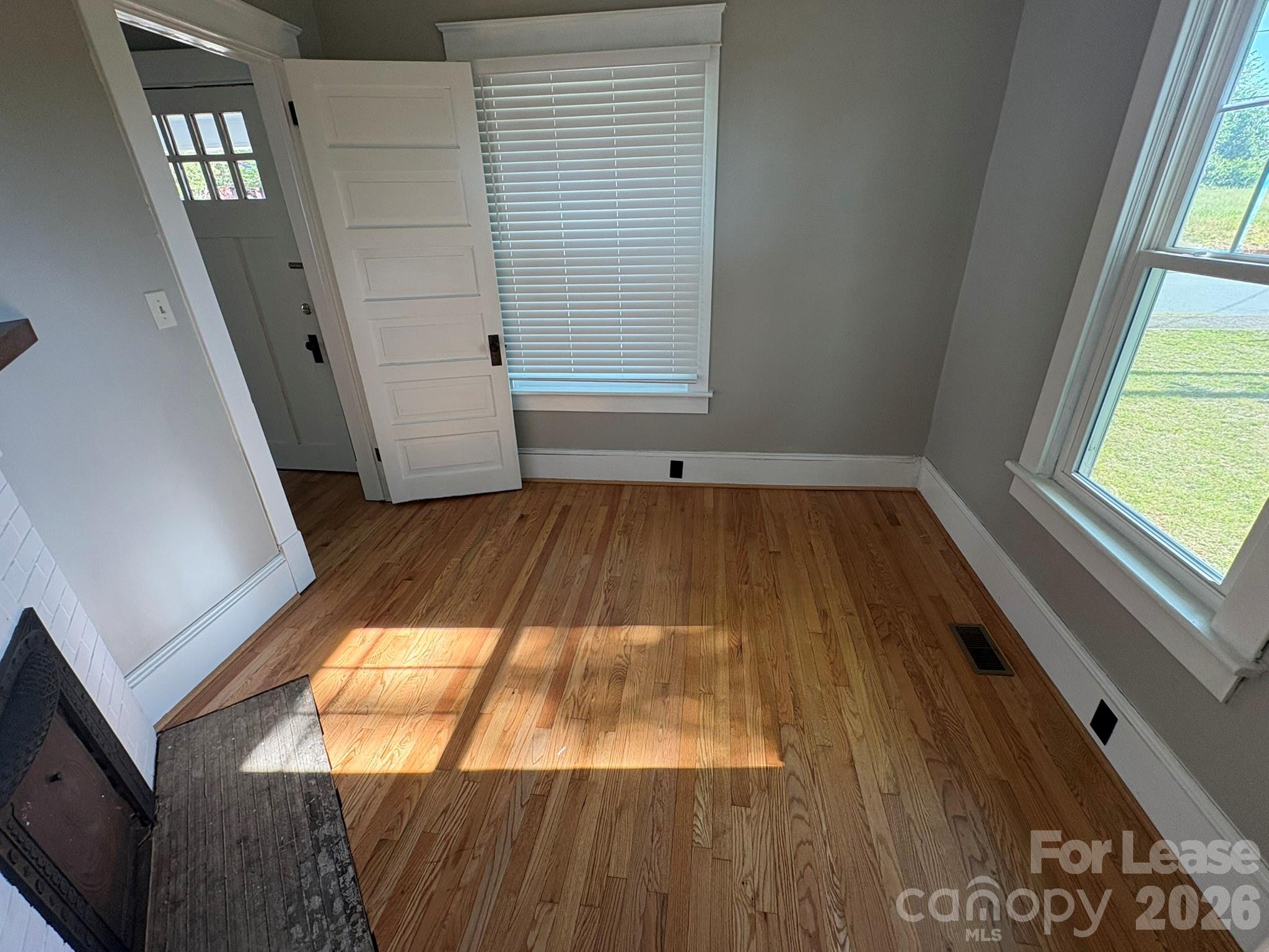 303 Bouchelle Street Morganton, NC 28655 - Photo 4 of 12 a view of a room with wooden floor and staircase