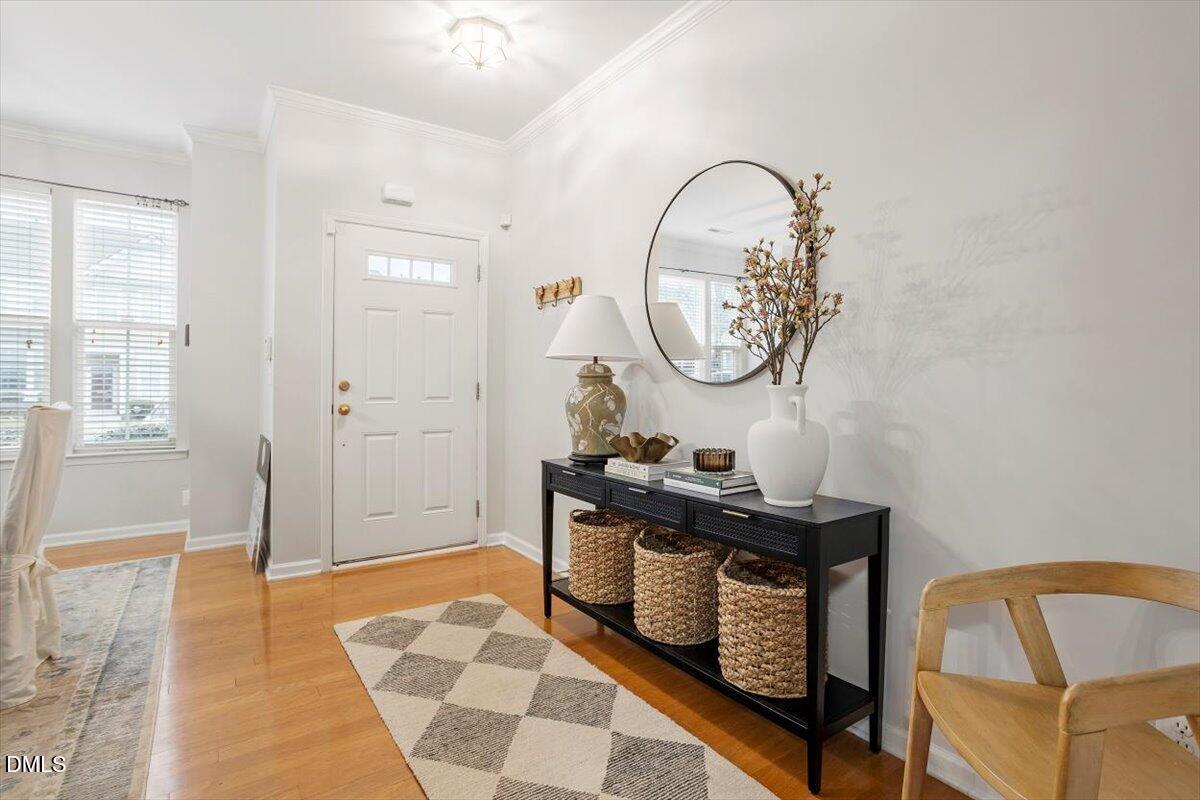 5349 Silver Moon Lane Raleigh, NC 27606 - Photo 10 of 41 a living room with table chairs and a rug