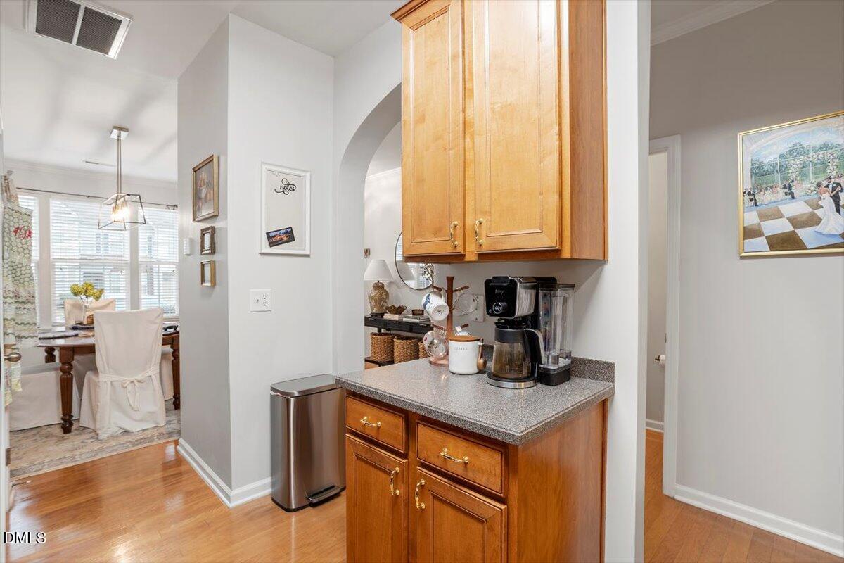 5349 Silver Moon Lane Raleigh, NC 27606 - Photo 16 of 41 a kitchen with stainless steel appliances granite countertop a refrigerator and a stove top oven