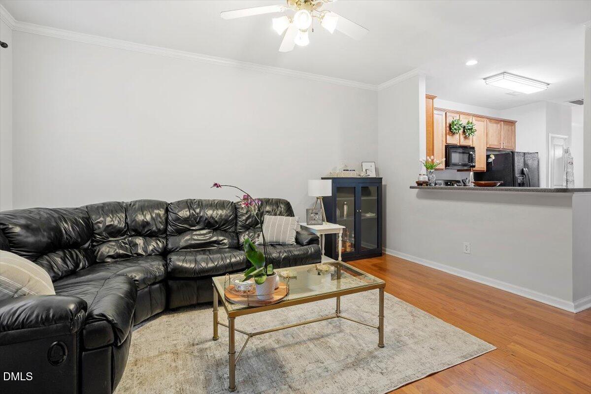 5349 Silver Moon Lane Raleigh, NC 27606 - Photo 19 of 41 a living room with furniture and a fireplace