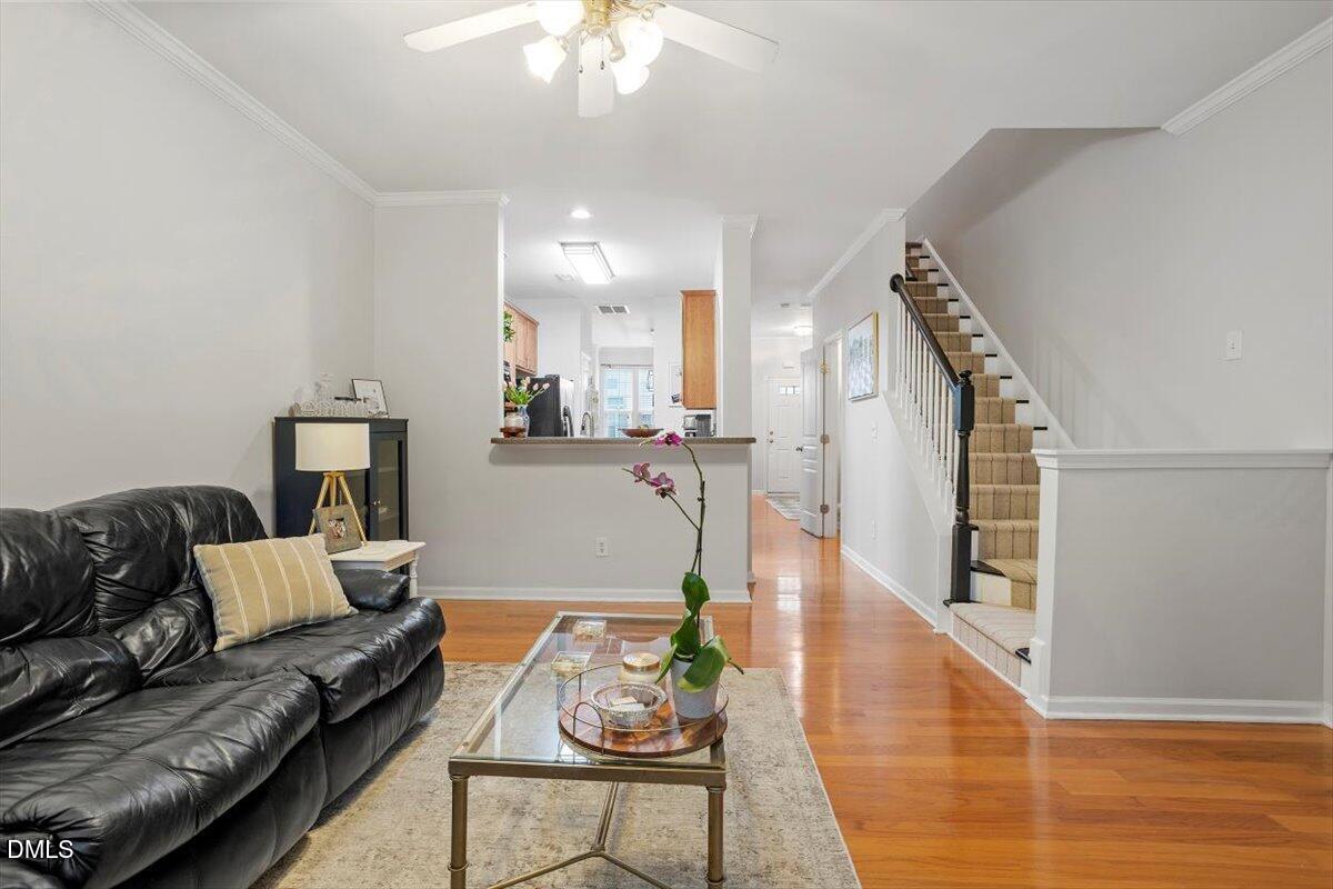 5349 Silver Moon Lane Raleigh, NC 27606 - Photo 20 of 41 a living room with furniture and wooden floor