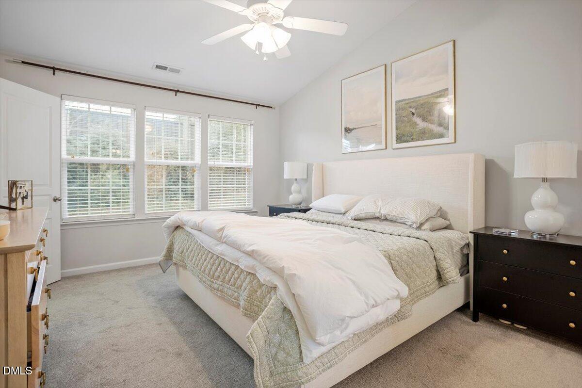 5349 Silver Moon Lane Raleigh, NC 27606 - Photo 26 of 41 a spacious bedroom with a bed and a window