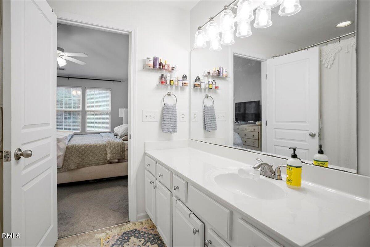 5349 Silver Moon Lane Raleigh, NC 27606 - Photo 31 of 41 a en suite bathroom with a sink double vanity and a mirror
