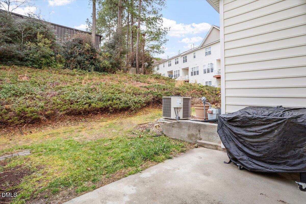 5349 Silver Moon Lane Raleigh, NC 27606 - Photo 34 of 41 a view of a chair and table in backyard