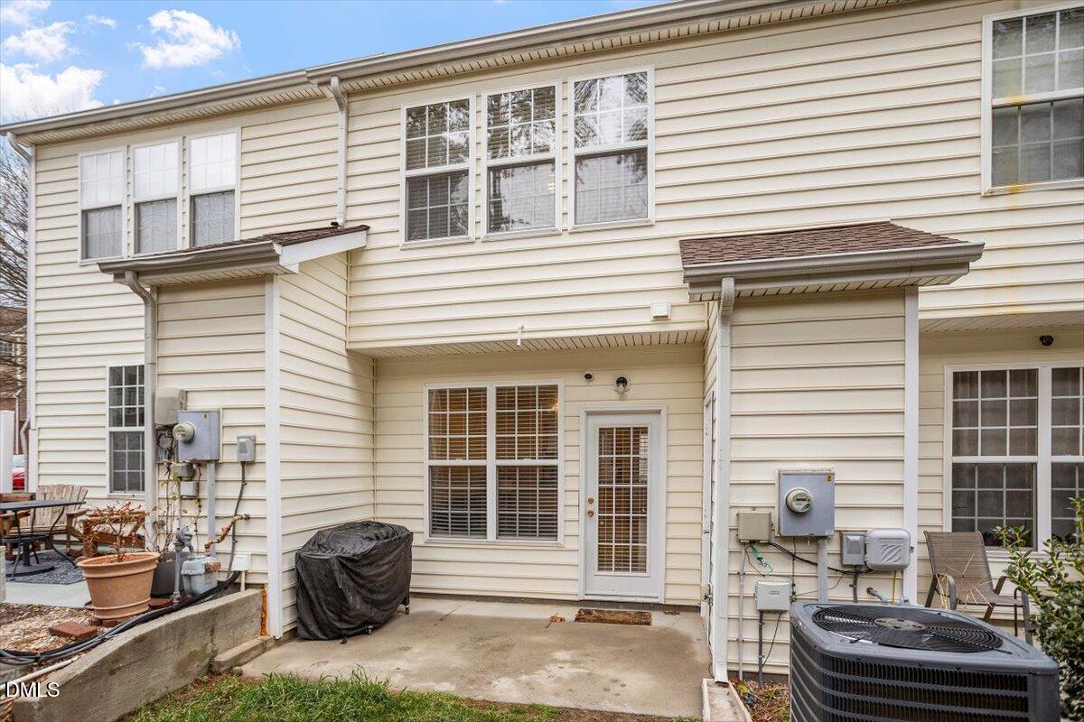 5349 Silver Moon Lane Raleigh, NC 27606 - Photo 35 of 41 a front view of a house with outdoor seating