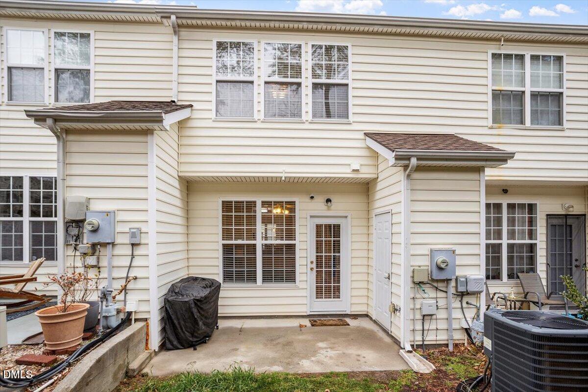5349 Silver Moon Lane Raleigh, NC 27606 - Photo 36 of 41 a front view of a house with patio