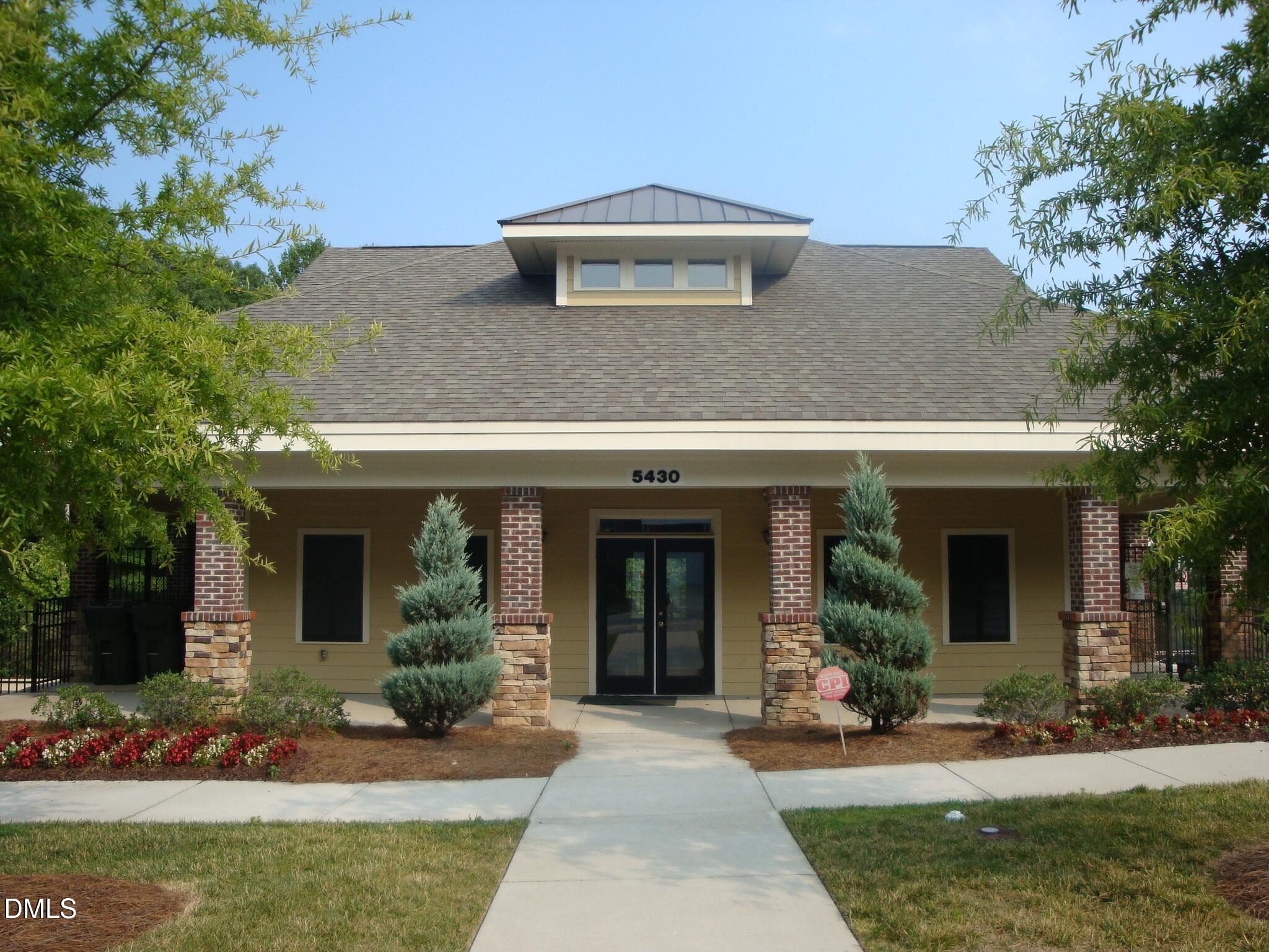 5349 Silver Moon Lane Raleigh, NC 27606 - Photo 38 of 41 a front view of a house with garden