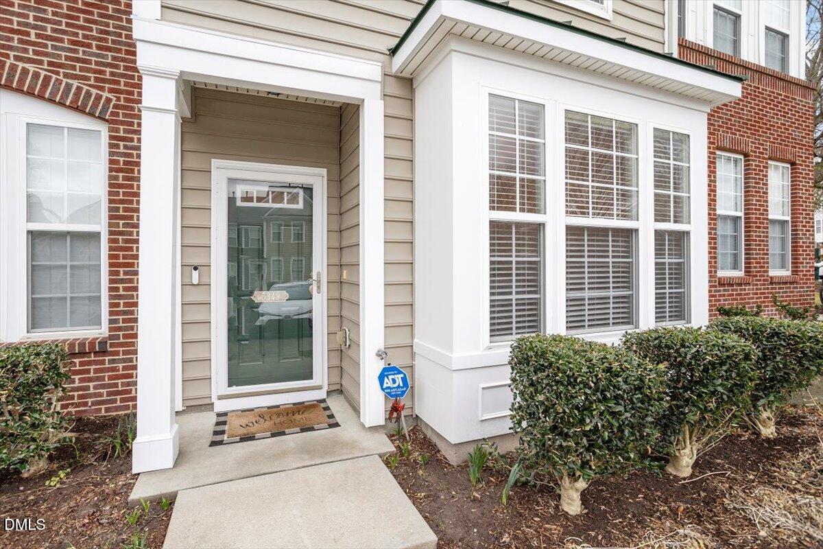 5349 Silver Moon Lane Raleigh, NC 27606 - Photo 4 of 41 a front view of a house with a garden