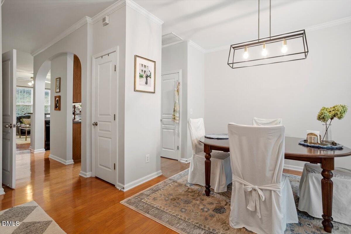 5349 Silver Moon Lane Raleigh, NC 27606 - Photo 5 of 41 a view of a hallway with workspace and wooden floor