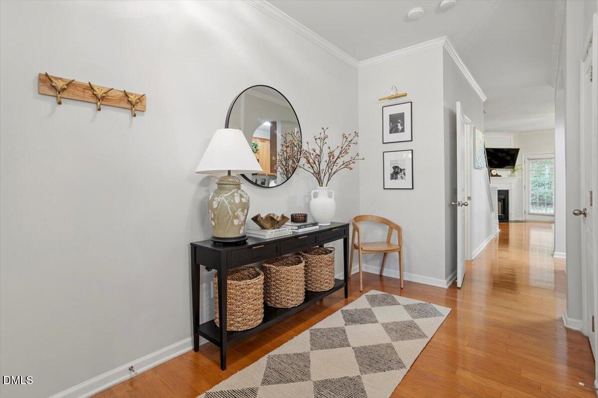 5349 Silver Moon Lane Raleigh, NC 27606 - Photo 6 of 41 a view of living room with furniture and wooden floor